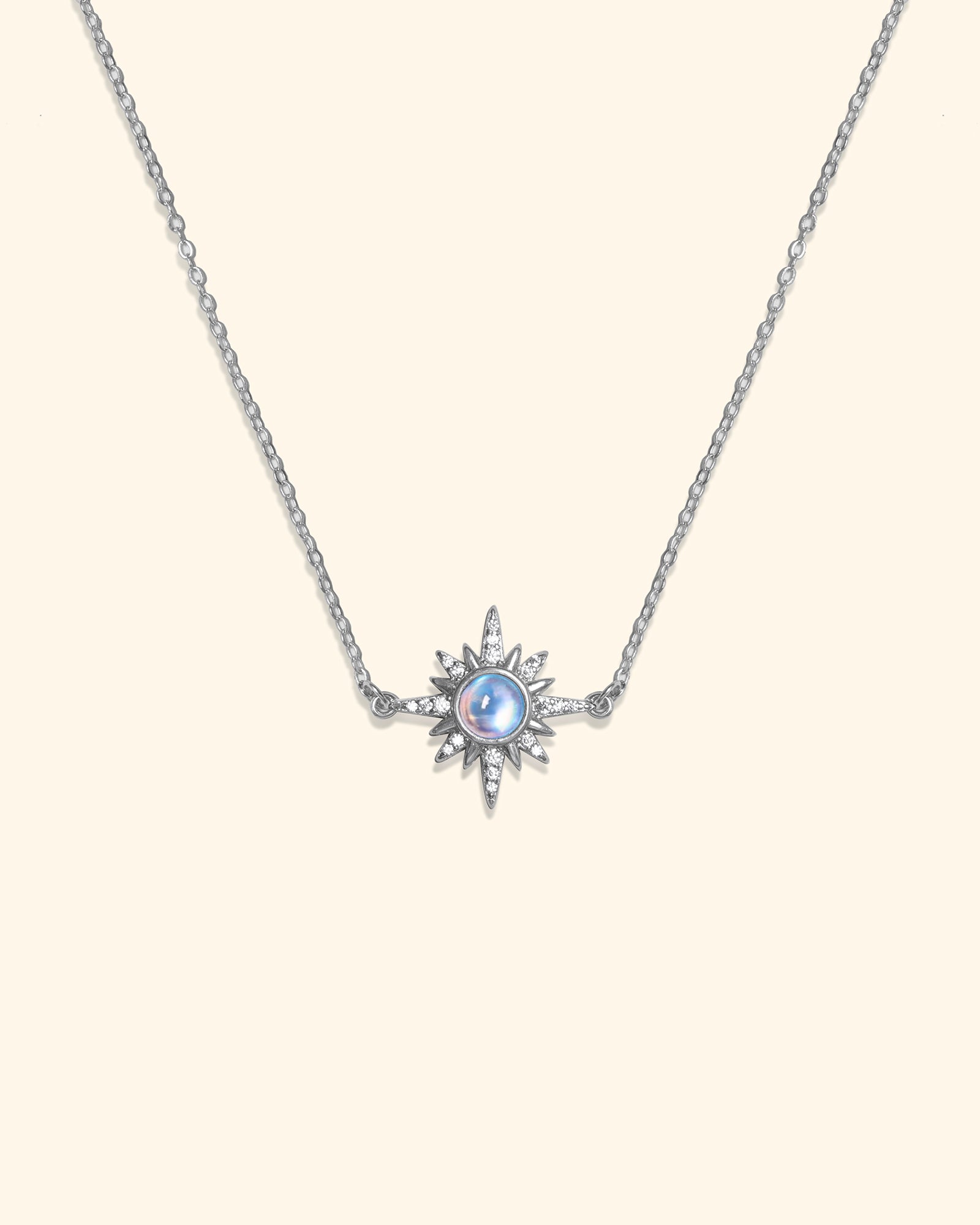 Choodo 925 sterling silver classical sun pendant necklace with natural moonstone on cream background