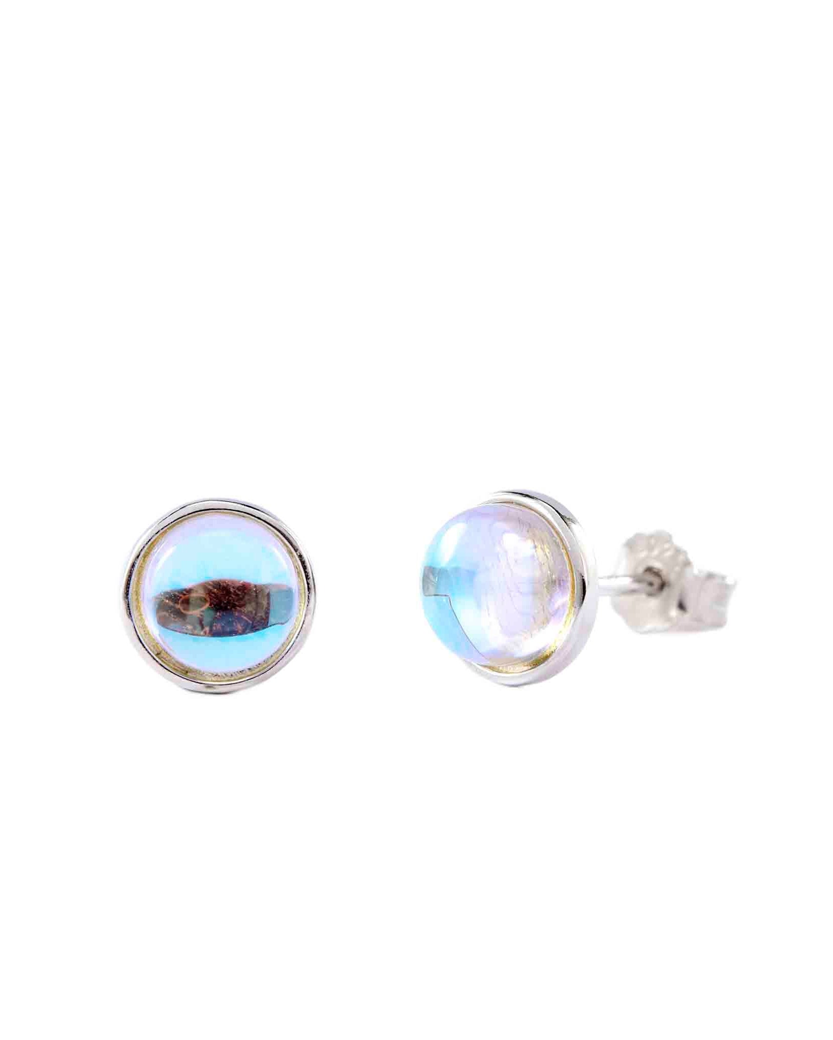 Pair of round rainbow moonstone stud earrings on a white background