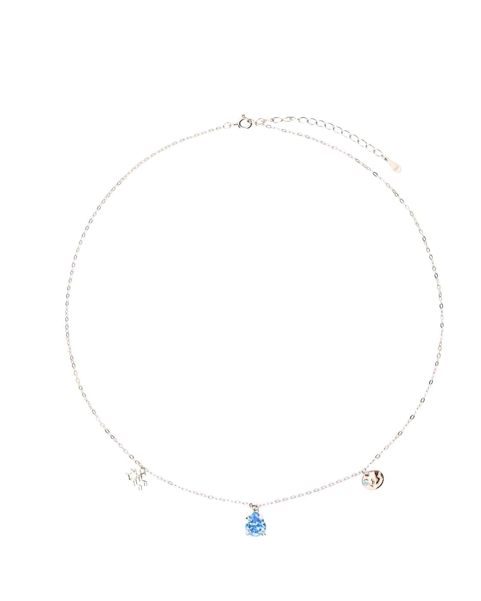 Necklace with three charms on a white background