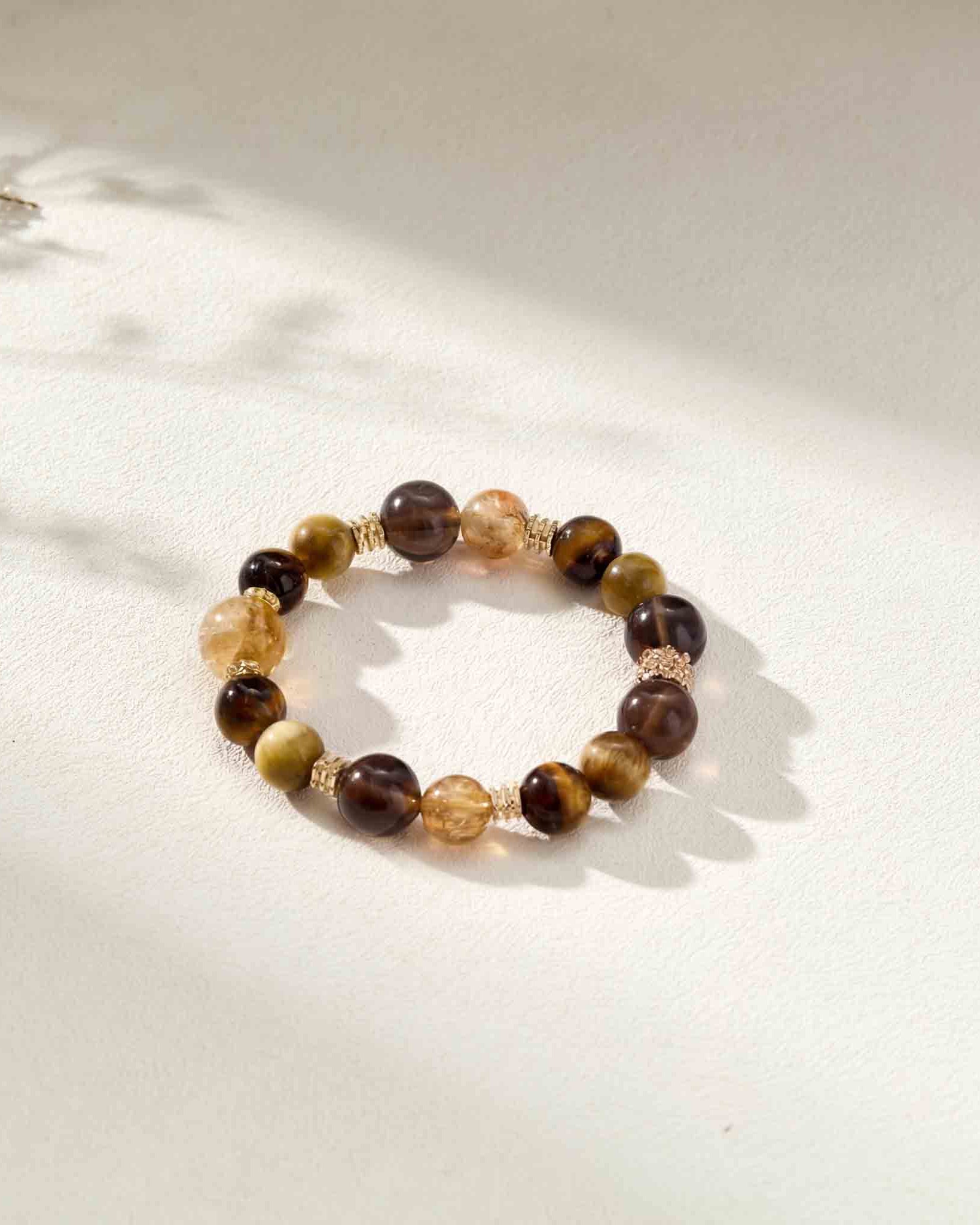 Beaded bracelet with brown and beige stones on a light background